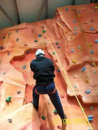 Spud climbing the wall